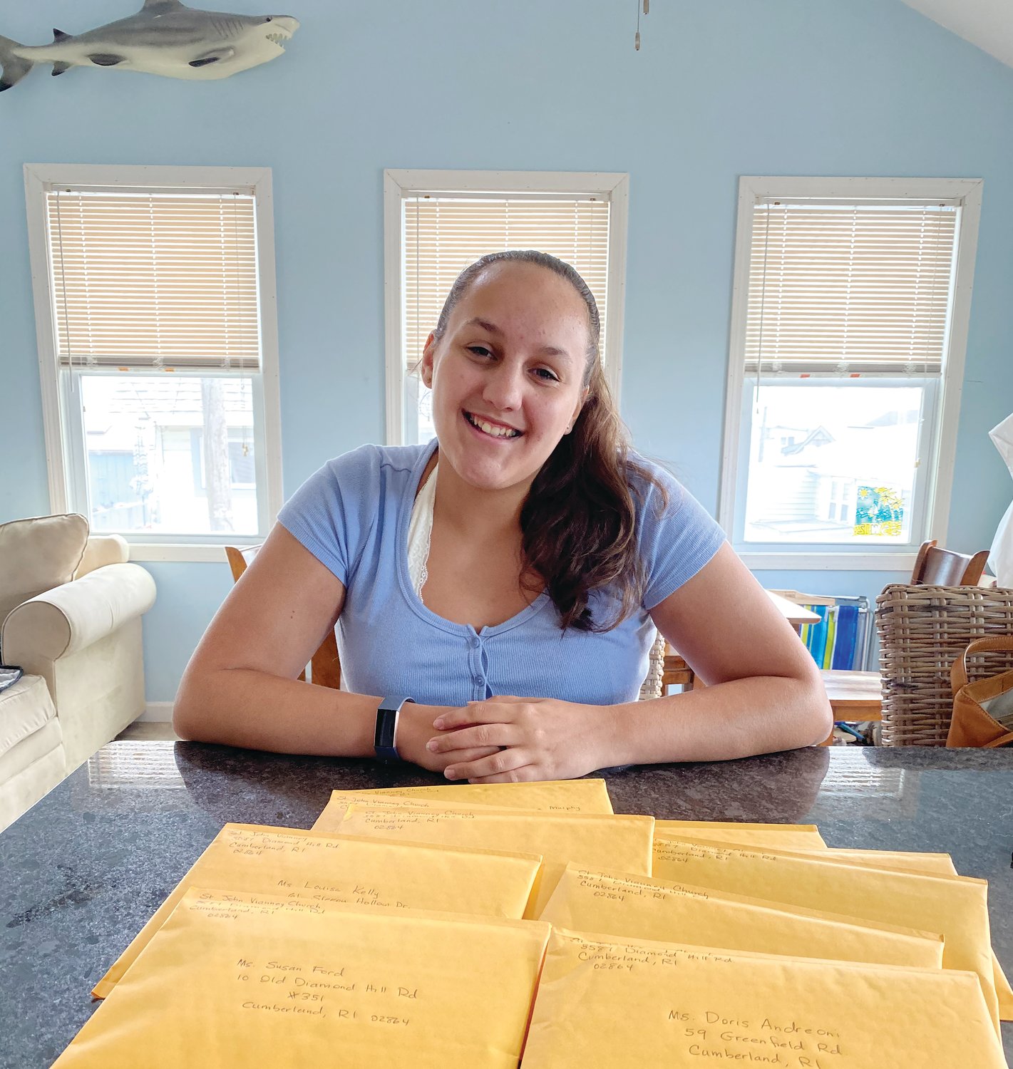 Teens from St. John Vianney Church Youth Ministry send out cards and letters to more than 200 parishioners as a loving reminder that they are keeping them in prayer.